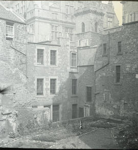 View of backcourt garden with houses and city library in background